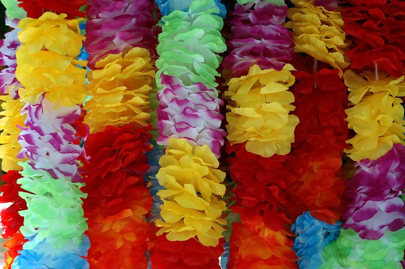 Rows of colorful Hawaiian flower leis